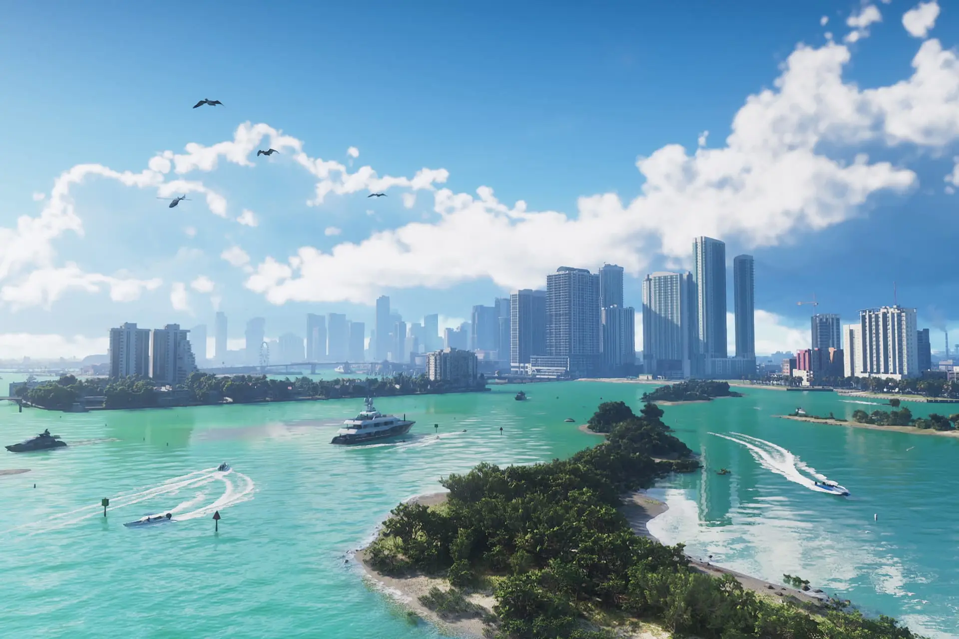 Skyline of tall towers beyond a turquoise bay with speedboats, a yacht, a wooded island and birds flying in a blue sky.